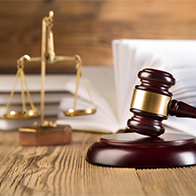 Image of a legal scale and judges gavel