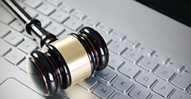 Image of a gavel on a keyboard