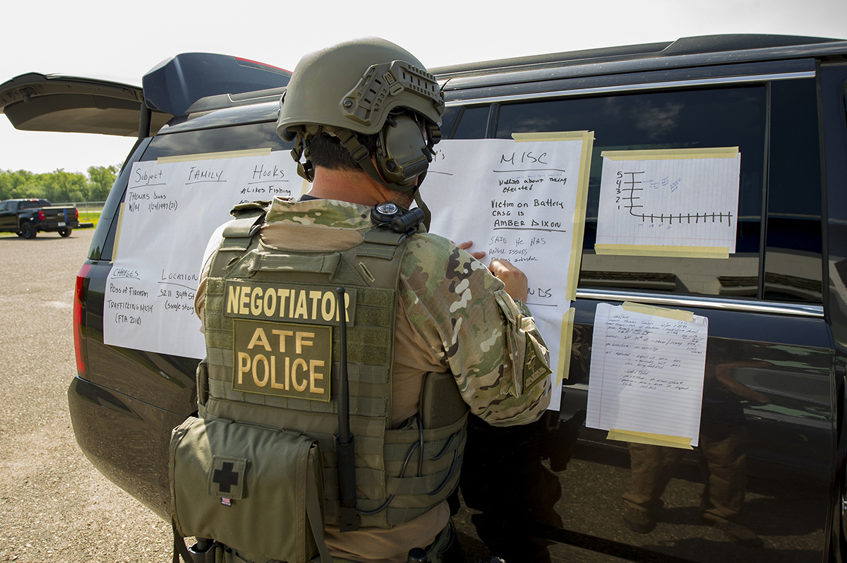 An ATF crisis negotiator drafts up a situation board to manage a crisis An ATF crisis negotiator drafts up a situation board to manage a crisis