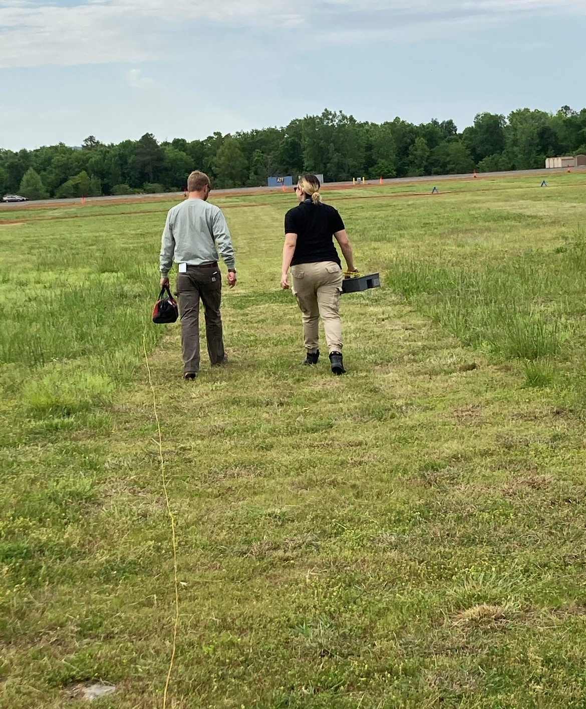 Sonia Melendez Moreno walking in a field with a colleague
