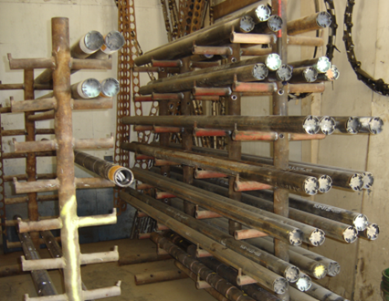 Jet perforating guns used to pierce oil and gas wells in preparation for production operations.