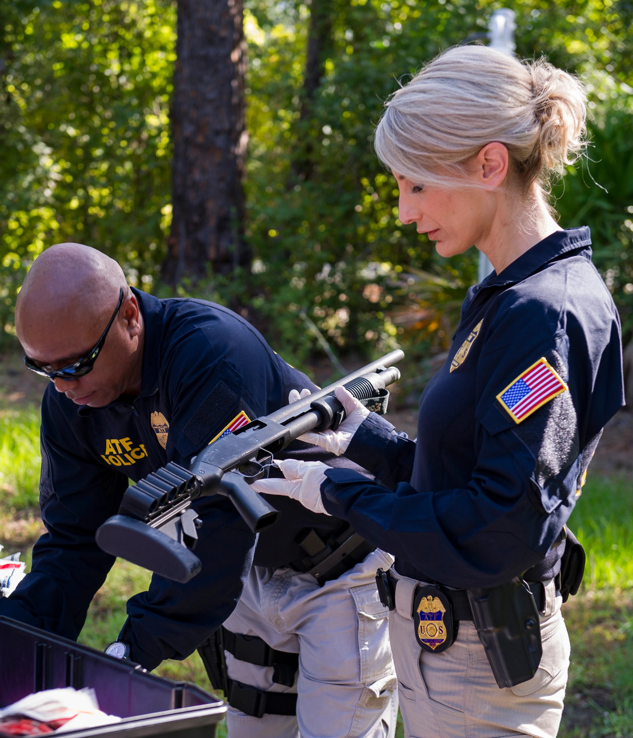Katherine Eberhardt inspecting a firearm.