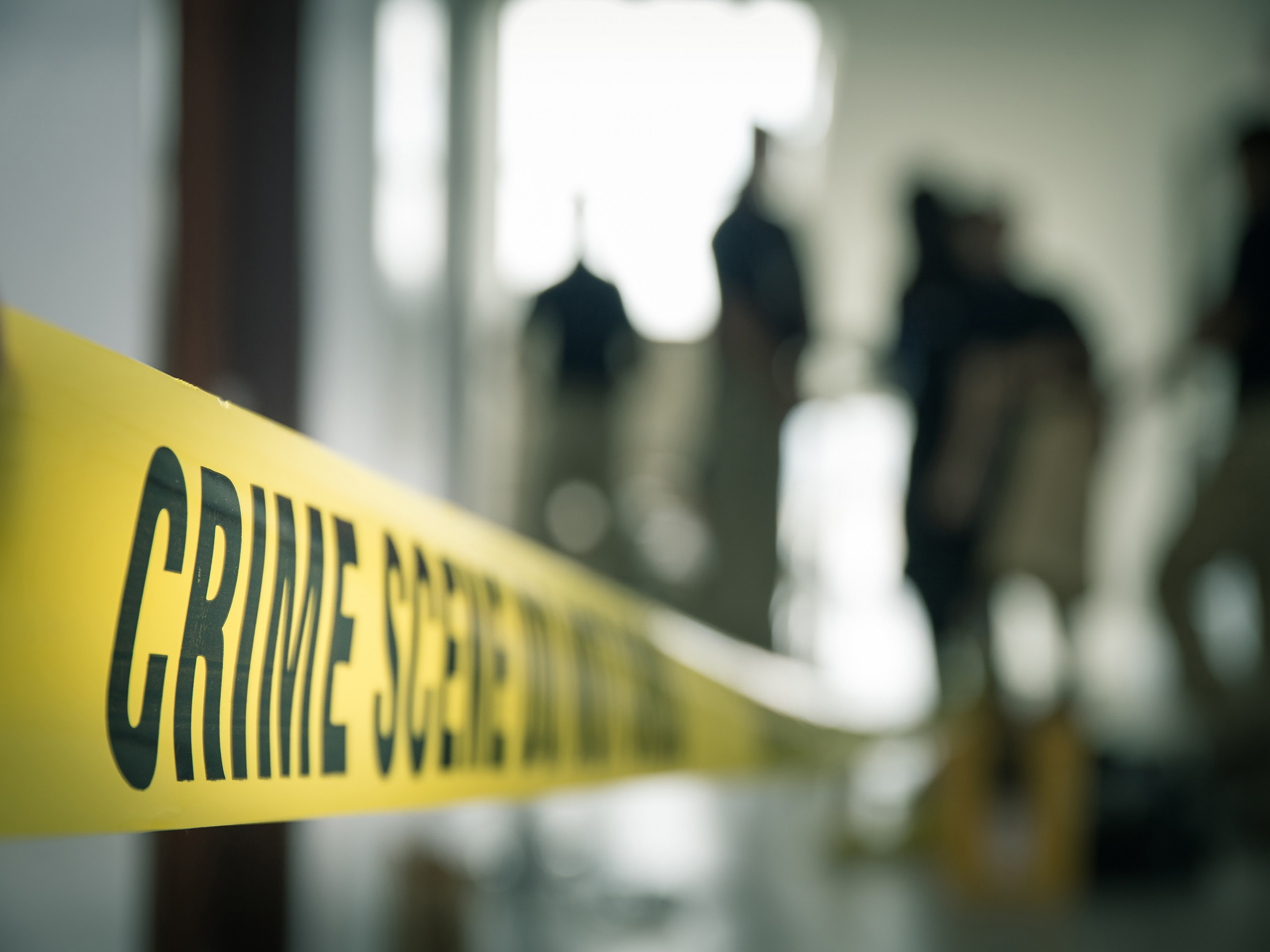 Yellow tape in front of crime scene