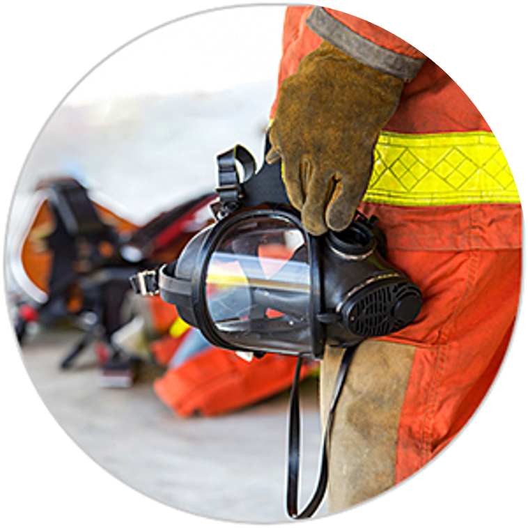 Firefighter holding a mask