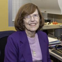 Carol Kelley sits at her desk in ATF Headquarters in Washington, DC. 